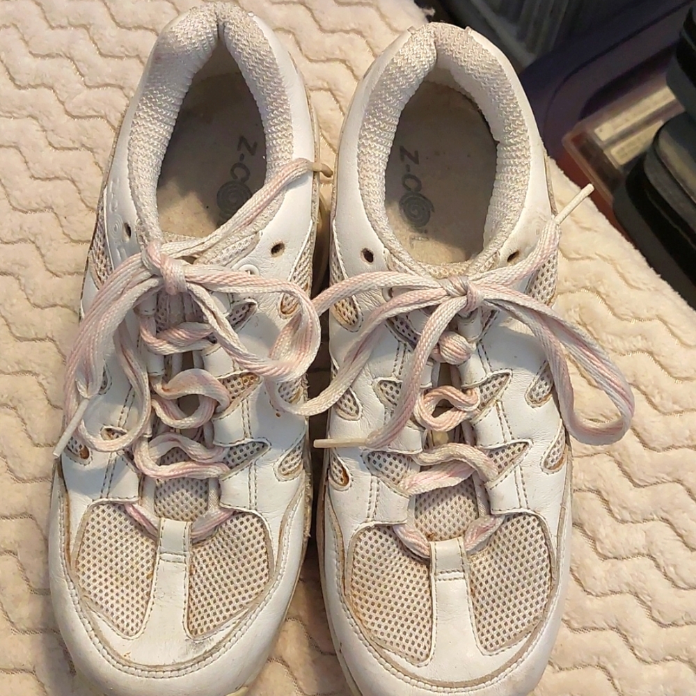Previously loved white Z-Coil tennis shoes in size 8.